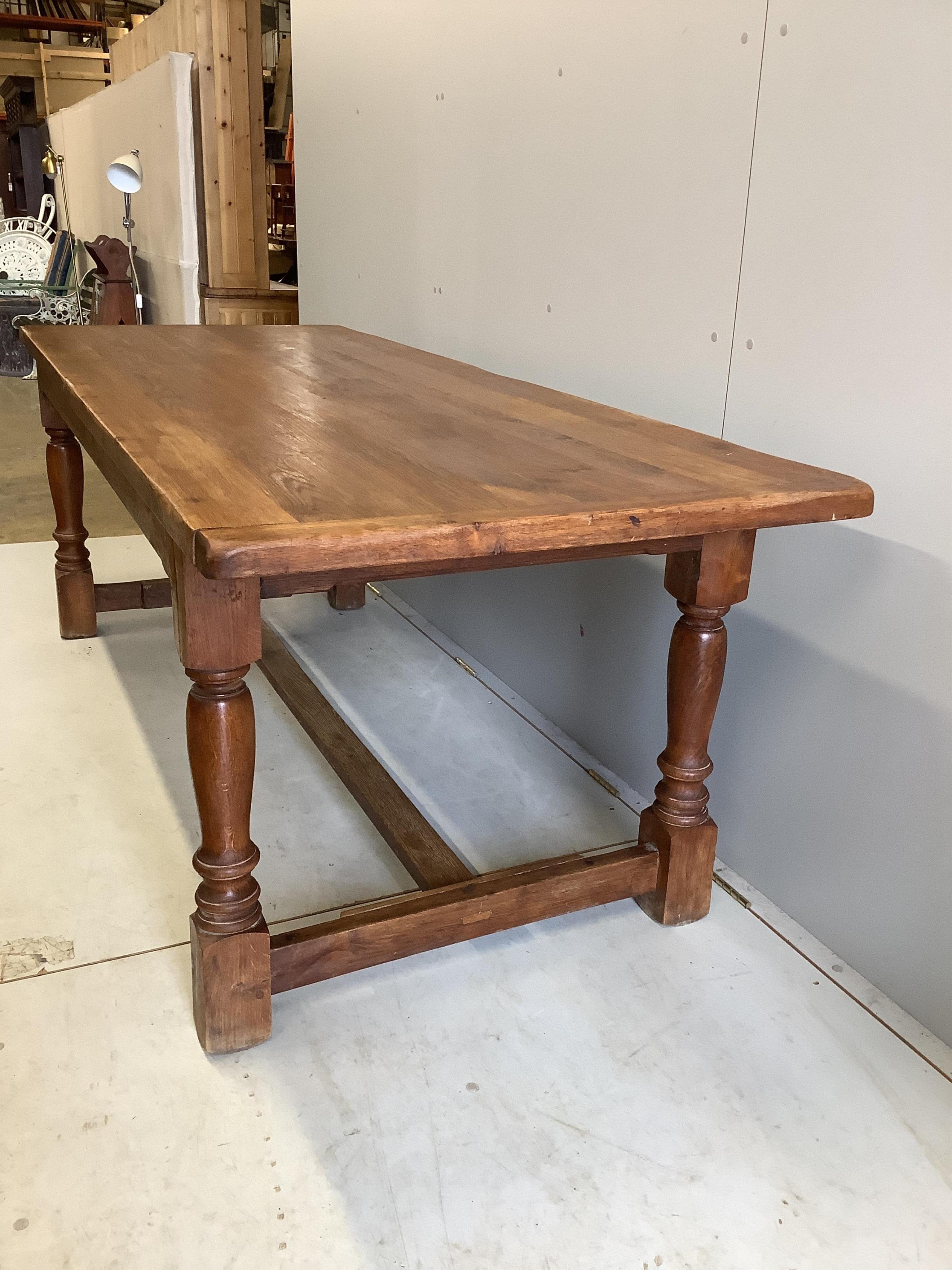 A rectangular oak refectory dining table, width 220cm, depth 84cm, height 74cm. Condition - fair